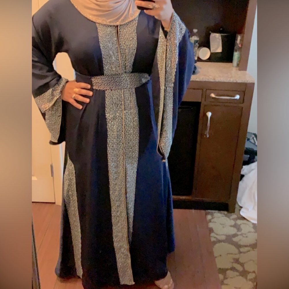 Dubai style abaya. worn open or closed. Navy blue with silver embellishments.
